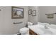 Cozy half bathroom with a toilet, sink, and decorative wall art at 2635 W Angel Way, San Tan Valley, AZ 85144