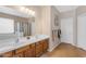 Well-lit bathroom featuring a double sink vanity, neutral walls, and tile flooring at 2635 W Angel Way, San Tan Valley, AZ 85144