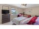 Bright bedroom with two beds, a large window, and dresser at 2635 W Angel Way, San Tan Valley, AZ 85144