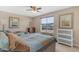 Bedroom featuring two beds, a window with natural light, and ample storage at 2635 W Angel Way, San Tan Valley, AZ 85144