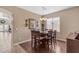 Dining room featuring hardwood floors, a chandelier, and a large window with backyard views at 2635 W Angel Way, San Tan Valley, AZ 85144