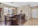 Dining room featuring wood floors, a chandelier, and a large window at 2635 W Angel Way, San Tan Valley, AZ 85144