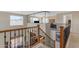 Foyer with wood railing and view of the living spaces at 2635 W Angel Way, San Tan Valley, AZ 85144