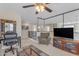 Bright living room featuring carpet, ceiling fan, and an entertainment area at 2635 W Angel Way, San Tan Valley, AZ 85144