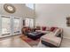 Open concept living area with high ceilings and ample seating, perfect for relaxation and gatherings at 2635 W Angel Way, San Tan Valley, AZ 85144