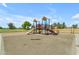 Community playground with slides and a shaded play structure on a sunny day at 2635 W Angel Way, San Tan Valley, AZ 85144