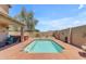 Backyard oasis featuring a beautiful pool, hot tub, and a desert landscape at 2635 W Angel Way, San Tan Valley, AZ 85144