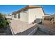 Backyard featuring gravel landscaping, a patio area, and an air conditioning unit at 2724 S Chaparral Rd, Apache Junction, AZ 85119