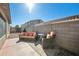 Cozy backyard patio with comfortable seating and a privacy wall, perfect for outdoor relaxation at 2724 S Chaparral Rd, Apache Junction, AZ 85119