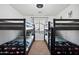 Bright bedroom featuring two bunk beds and a window providing natural light at 2724 S Chaparral Rd, Apache Junction, AZ 85119