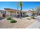 Charming home featuring desert landscaping, a covered porch, and a well-maintained front yard at 2724 S Chaparral Rd, Apache Junction, AZ 85119
