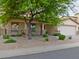Charming single-story home featuring desert landscaping, a two car garage, and a covered front porch at 2724 S Chaparral Rd, Apache Junction, AZ 85119