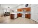 Well-lit kitchen with wooden cabinets, white appliances, and adjacent dining area at 2724 S Chaparral Rd, Apache Junction, AZ 85119