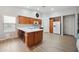Spacious kitchen with white countertops, wood cabinets, central island and modern appliances at 2724 S Chaparral Rd, Apache Junction, AZ 85119