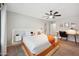Spacious main bedroom featuring a ceiling fan, and a desk area, providing comfort and functionality at 2724 S Chaparral Rd, Apache Junction, AZ 85119