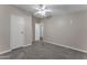 Carpeted bedroom features a ceiling fan and white trim at 30032 N Bryce Trl, San Tan Valley, AZ 85144