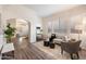Bright living room with wood floors, large windows, neutral paint, and an open layout for versatile living at 30420 N 43Rd St, Cave Creek, AZ 85331