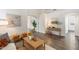 Stylish living room with wood floors, neutral decor, and an open design creating a welcoming and versatile living space at 30420 N 43Rd St, Cave Creek, AZ 85331