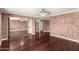 Bedroom featuring hardwood floors, neutral walls, walk-in closet, and crown molding at 3135 W Echo Ln, Phoenix, AZ 85051