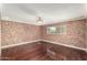 Bedroom features hardwood floors and neutral wall with crown molding at 3135 W Echo Ln, Phoenix, AZ 85051