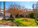 A single-story home with a charming front yard including small trees at 3135 W Echo Ln, Phoenix, AZ 85051