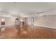 Expansive living room showcasing tile flooring, neutral walls, recessed lighting, and views to kitchen at 3135 W Echo Ln, Phoenix, AZ 85051
