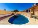 Backyard features a refreshing pool surrounded by concrete patio, perfect for outdoor relaxation and entertaining at 3135 W Echo Ln, Phoenix, AZ 85051