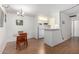 The dining area features a simple table and chairs, seamlessly connecting to the functional kitchen space with appliances at 3230 E Pinchot Ave # 2, Phoenix, AZ 85018