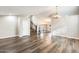 Open-concept living space featuring dark wood floors and a staircase to the upper level at 3752 W Alameda Rd, Glendale, AZ 85310