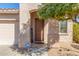 Inviting front entryway with a secure door, a cheerful welcome sign, and an ADT security system at 3804 W Ashton Dr, Anthem, AZ 85086