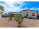 The backyard features a charming gazebo, complemented by low-maintenance gravel landscaping at 4051 S 243Rd Dr, Buckeye, AZ 85326
