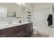 Bathroom featuring a double sink vanity, a toilet, and a shower with a curtain at 4051 S 243Rd Dr, Buckeye, AZ 85326