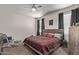 Comfortable bedroom with neutral walls, carpeted floors, and ample natural light at 4051 S 243Rd Dr, Buckeye, AZ 85326