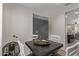 Cozy dining area with dark wood table, white chairs, and natural light at 4051 S 243Rd Dr, Buckeye, AZ 85326