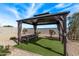 Backyard gazebo with elegant curtains, perfect for outdoor relaxation and entertaining at 4051 S 243Rd Dr, Buckeye, AZ 85326