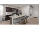 Modern kitchen featuring granite countertops, stainless steel appliances, and breakfast bar seating at 4051 S 243Rd Dr, Buckeye, AZ 85326