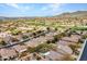Residential neighborhood with golf course views and desert landscaping, as seen from above at 41309 N Belfair Way, Anthem, AZ 85086