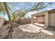 Inviting backyard with a covered patio and desert landscaping, perfect for enjoying the outdoors at 41309 N Belfair Way, Anthem, AZ 85086
