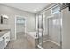 Bright bathroom featuring a soaking tub, glass shower, and double sink vanity at 41309 N Belfair Way, Anthem, AZ 85086