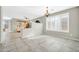 Bright dining room featuring tile floors, large windows with plantation shutters, and an elegant chandelier at 41309 N Belfair Way, Anthem, AZ 85086