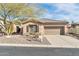 Charming single-story home with a desert landscape, tile roof and a two-car garage at 41309 N Belfair Way, Anthem, AZ 85086