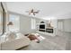 Bright living room featuring tile floors, a ceiling fan and a built-in entertainment center with fireplace at 41309 N Belfair Way, Anthem, AZ 85086