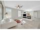 Bright living room featuring tile floors, a ceiling fan and a built-in entertainment center with fireplace at 41309 N Belfair Way, Anthem, AZ 85086