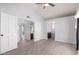 Vaulted ceiling primary bedroom with multiple doors and a hallway view; light neutral color palette throughout at 434 E Rosemonte Dr, Phoenix, AZ 85024