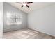 Sunlit bedroom with vaulted ceiling, ceiling fan and large window offering bright natural light at 434 E Rosemonte Dr, Phoenix, AZ 85024