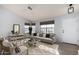 Bright living room featuring neutral tones, large windows, and stylish furnishings at 434 E Rosemonte Dr, Phoenix, AZ 85024