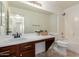 Cozy bathroom featuring a vanity, tile floors, a large mirror, and a separate tub and toilet at 4799 E Meadow Lark Way, San Tan Valley, AZ 85140