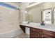 Bright bathroom featuring a shower-tub combination, tile floors, a large mirror, and a vanity at 4799 E Meadow Lark Way, San Tan Valley, AZ 85140