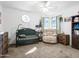 Cozy Bedroom with a rocking chair, crib, and natural light from the windows at 4901 W Beverly Ln, Glendale, AZ 85306