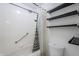Bathroom with tiled shower, tub, and floating shelves at 4950 N Miller Rd # 135, Scottsdale, AZ 85251